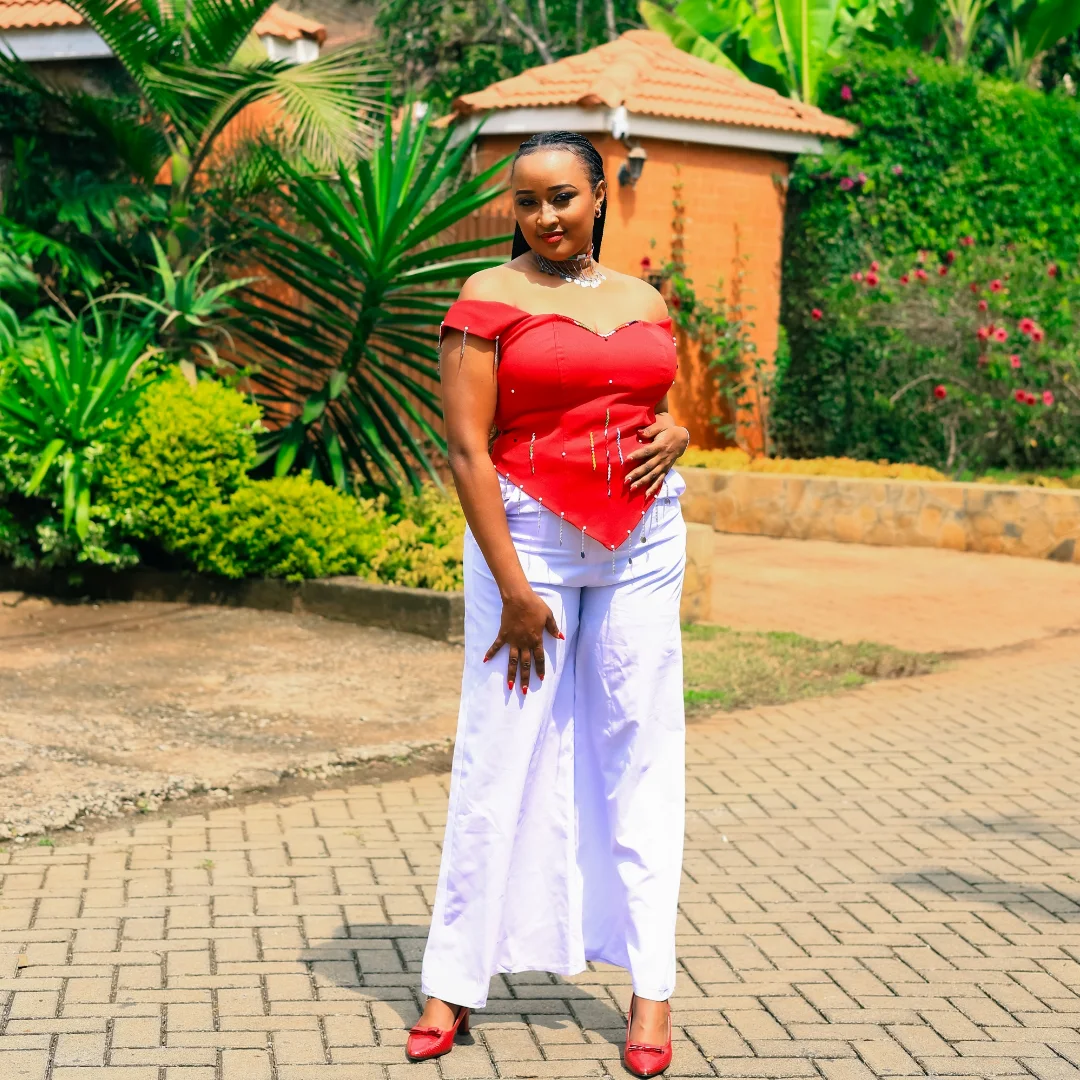 Red top with white trousers